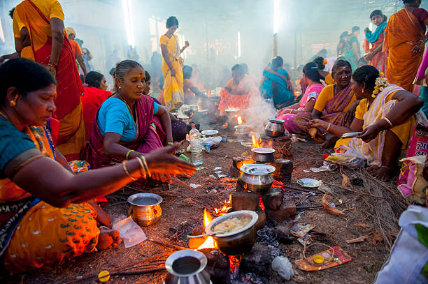 Mahabalipuram, India - March 14, 2014: Women are cooking together in a small village close to Mahabalipuram, during a local Hindu Festival.