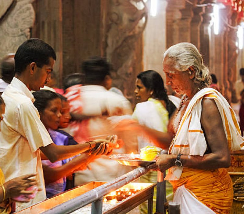 Madurai, India - April 25, 2009: Worshipers give offerings at the Meenakshi Amman Temple in Madurai, India.